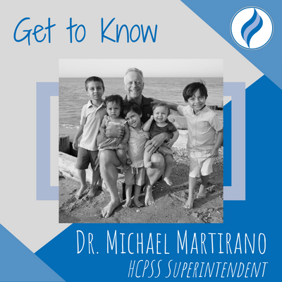 Photo of Michael Martirano posing at the beach with his grandchildren. Background of image says Get to Know ... Dr. Michael Martirano HCPSS Superintendent