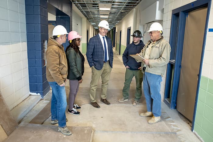 Josh Wasilewski meeting with construction workers at new HS#13.